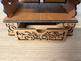 Petit tiroir de rangement intégré au socle du calendrier de l’Avent Grande Roue en bois